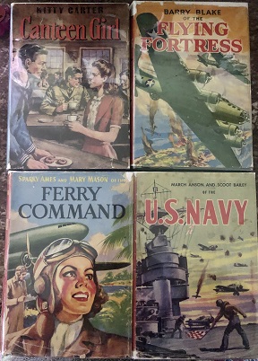 Four books spread on a table